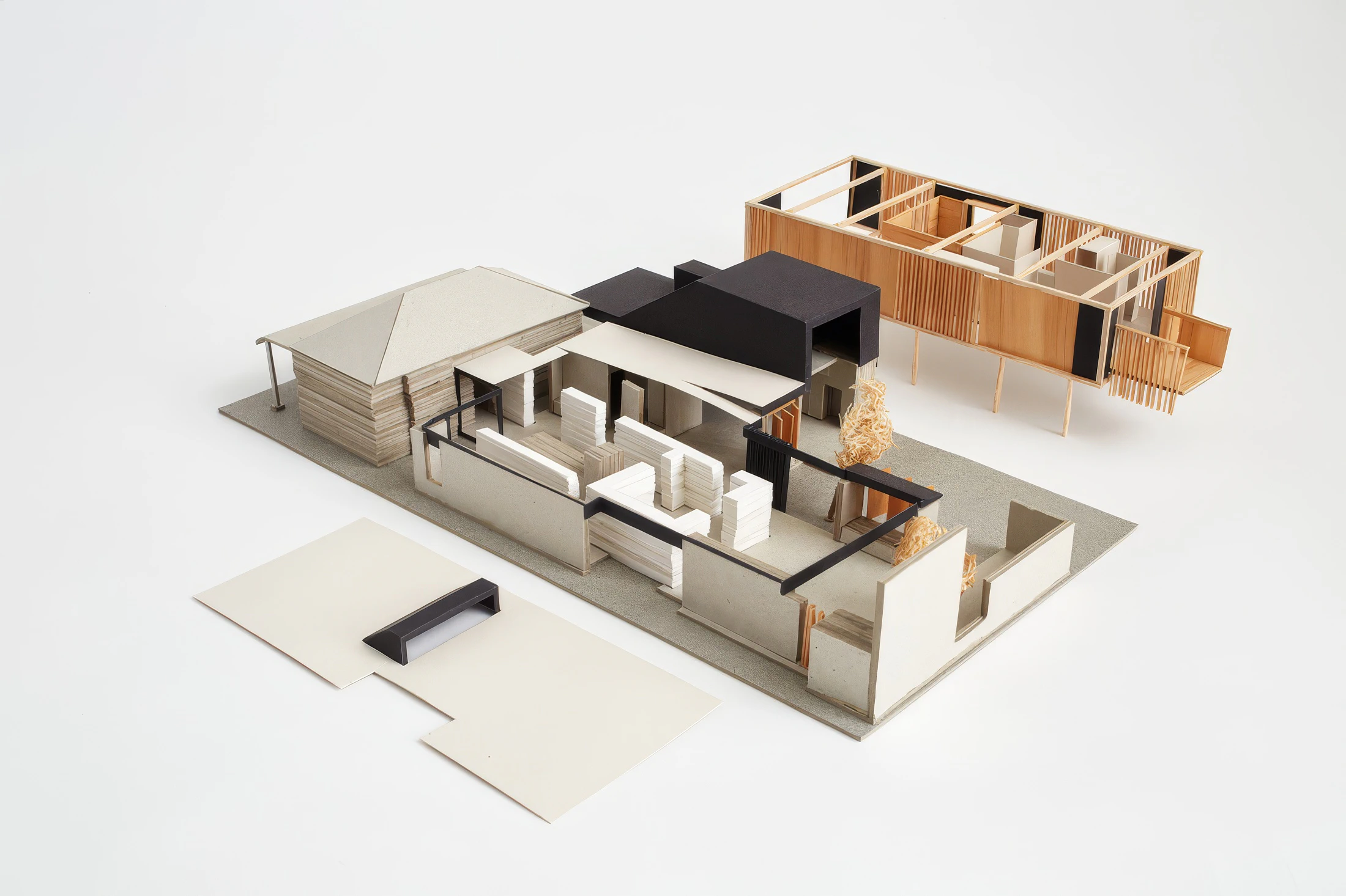 Architectural model of a modern building with multiple interiors and courtyard