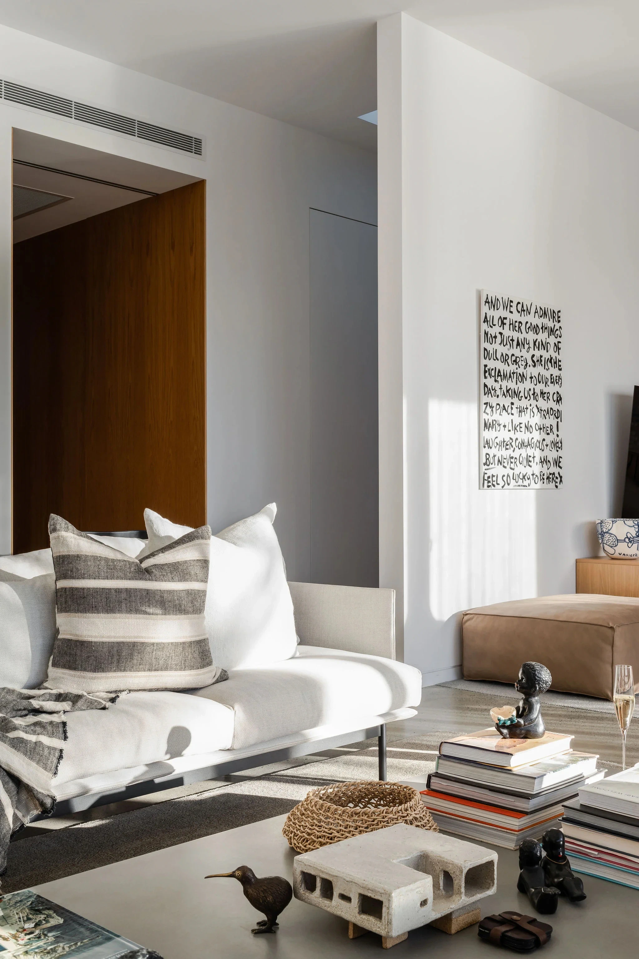Contemporary living room with sofa, coffee table and wall art