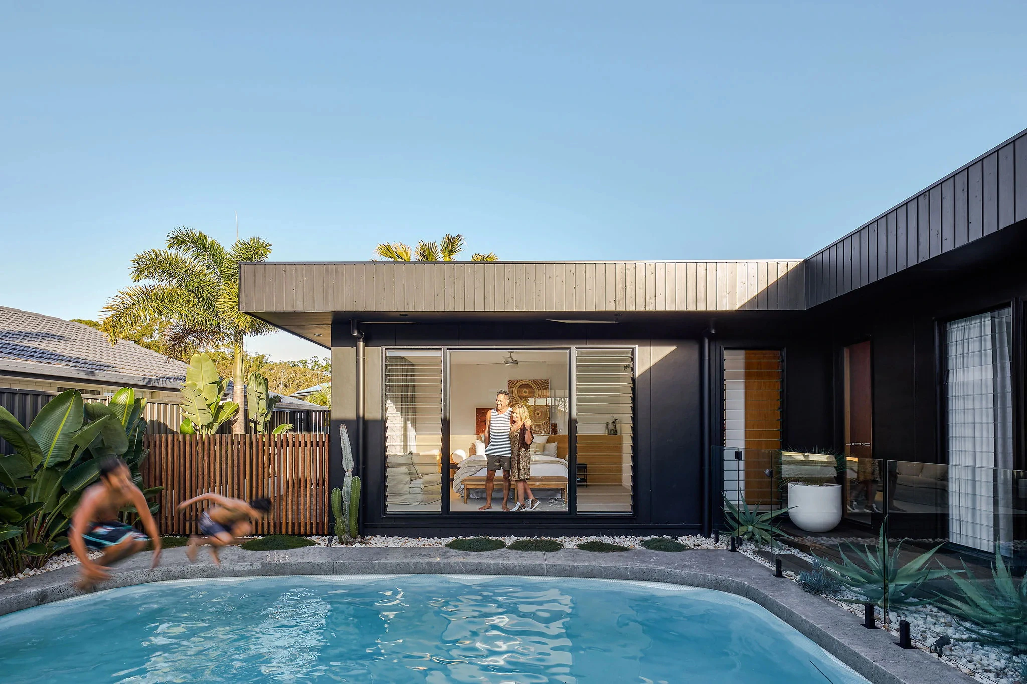 House courtyard featuring swimming pool and landscaped garden