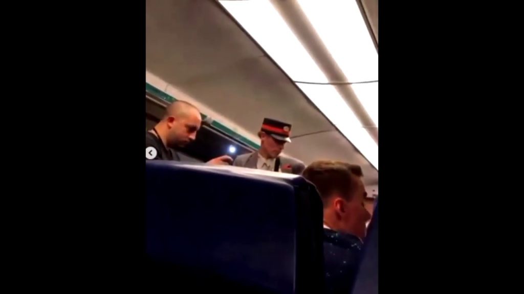 Police officer filmed telling black train passenger to return to Congo