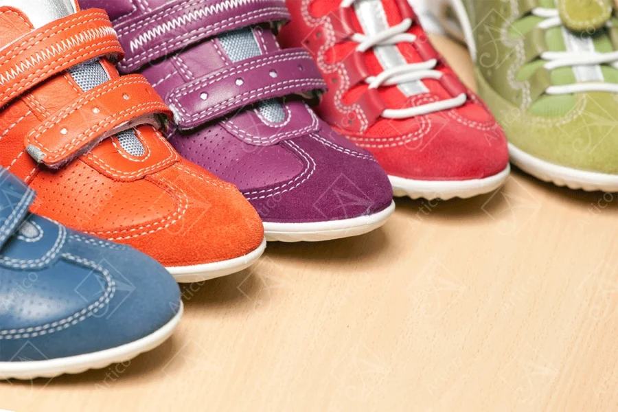 Articoo - Colorful unisex sneakers placed on a wooden table - Articoo_523985