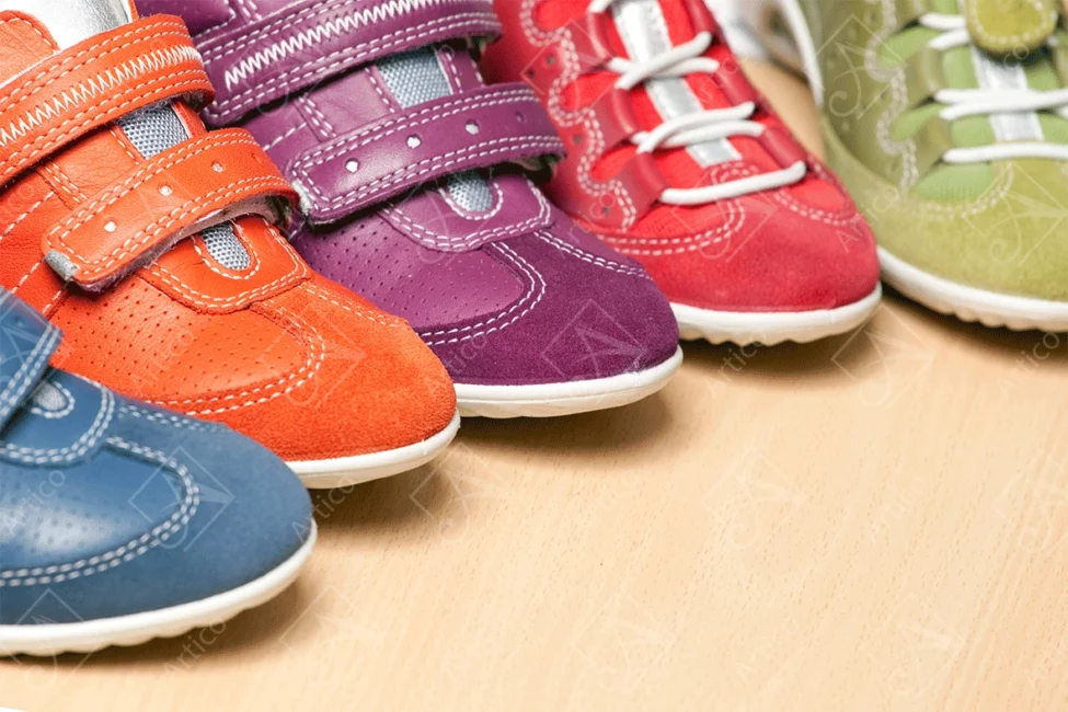 Articoo - Colorful unisex sneakers placed on a wooden table - Articoo_523985