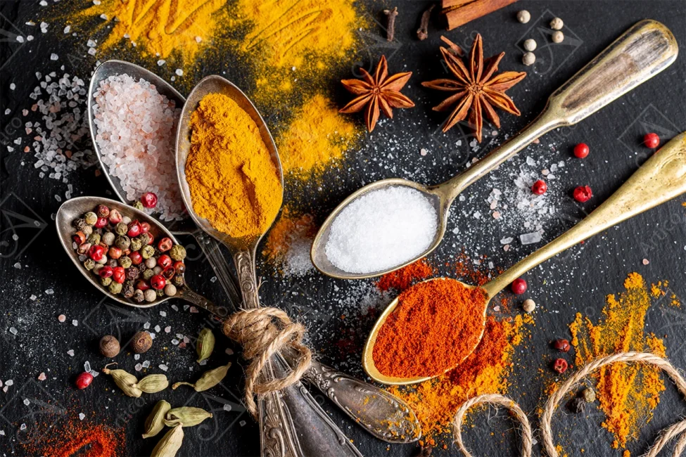 Articoo - Powder spices on spoons in black wooden table background - Articoo_549711