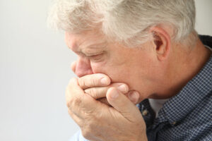 older adult man with bad breath