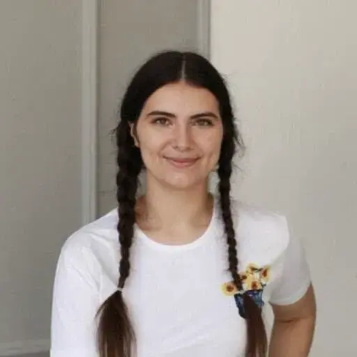 Smiling girl with layered hair, long eyelashes, happy gesture,
