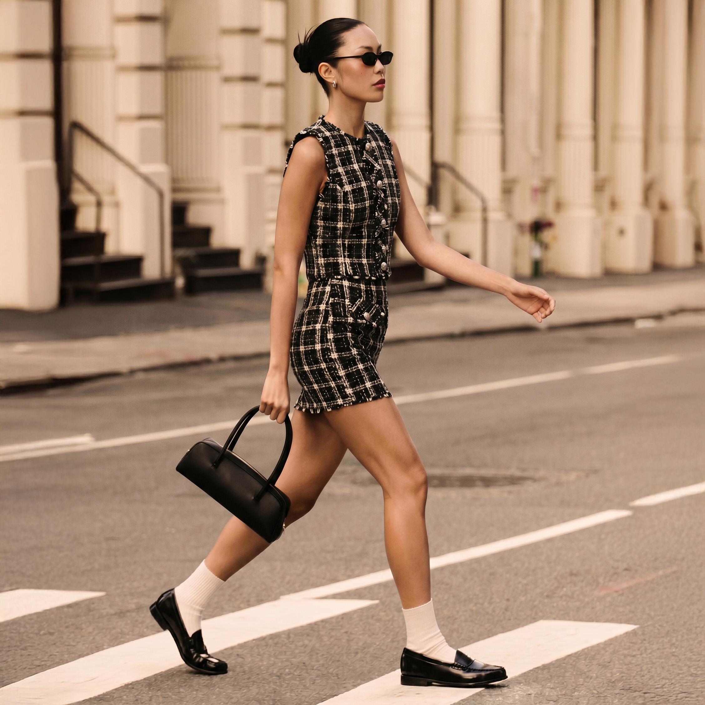 Woman in '90s matching plaid skirt set
