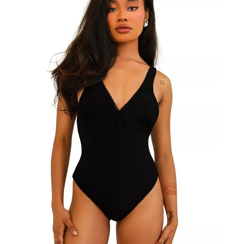Woman in Dippin' Daisy's One-Piece Swimsuit in Black