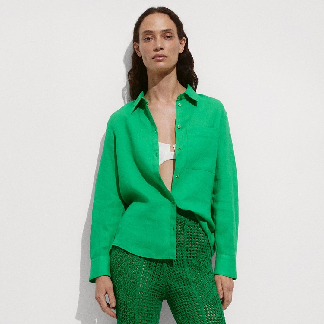 woman wearing green linen mango shirt