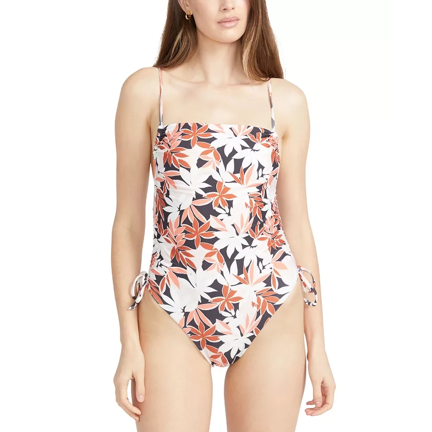 Woman in Volcom Printed Multicolored One-Piece Swimsuit