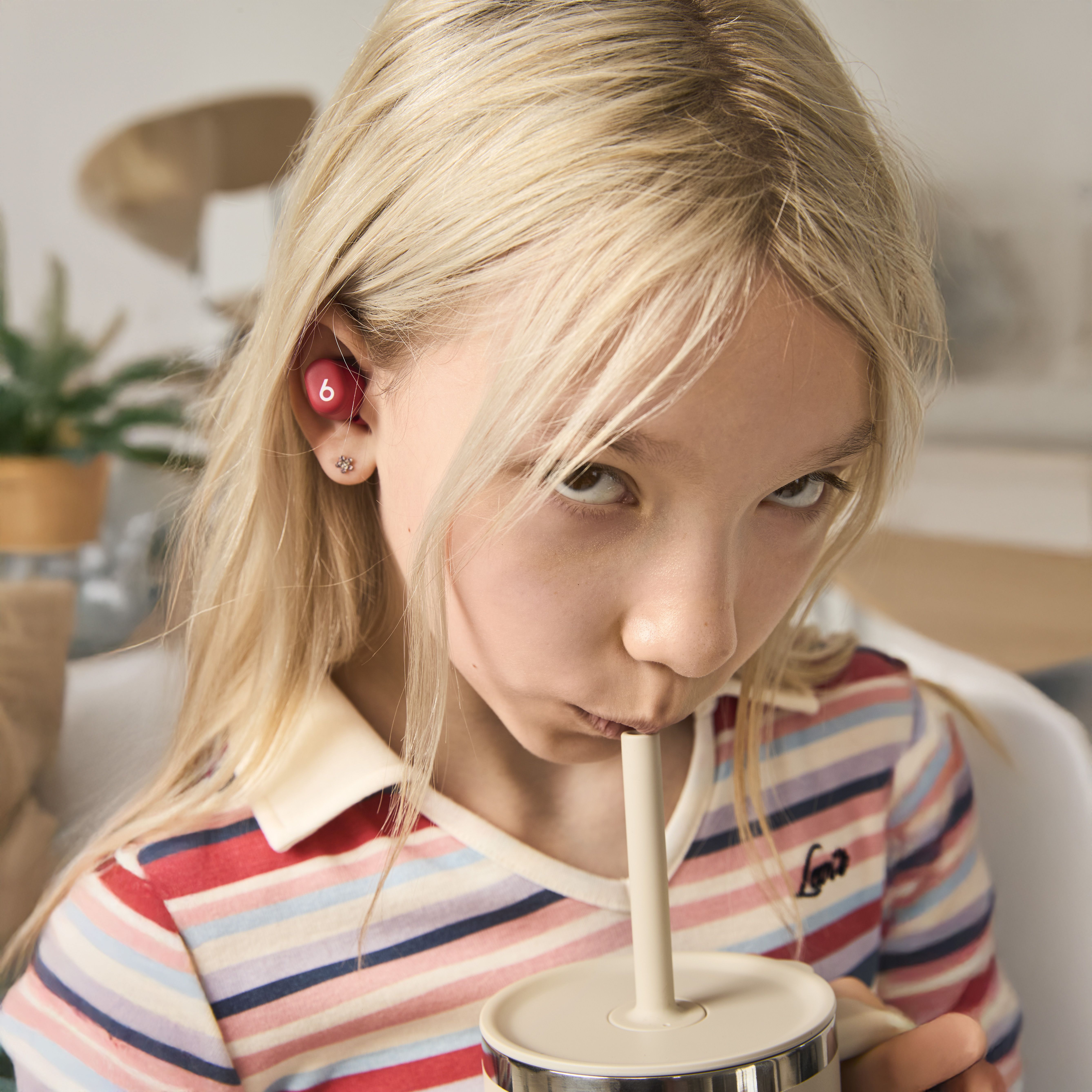 Child with back-to-school tumbler