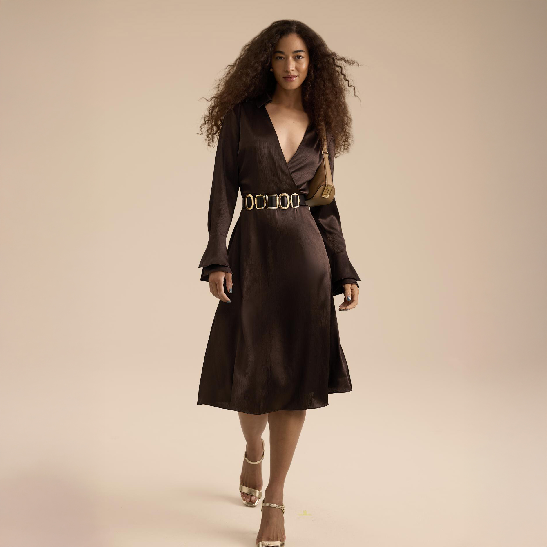 Woman in brown wedding guest semi-formal dress