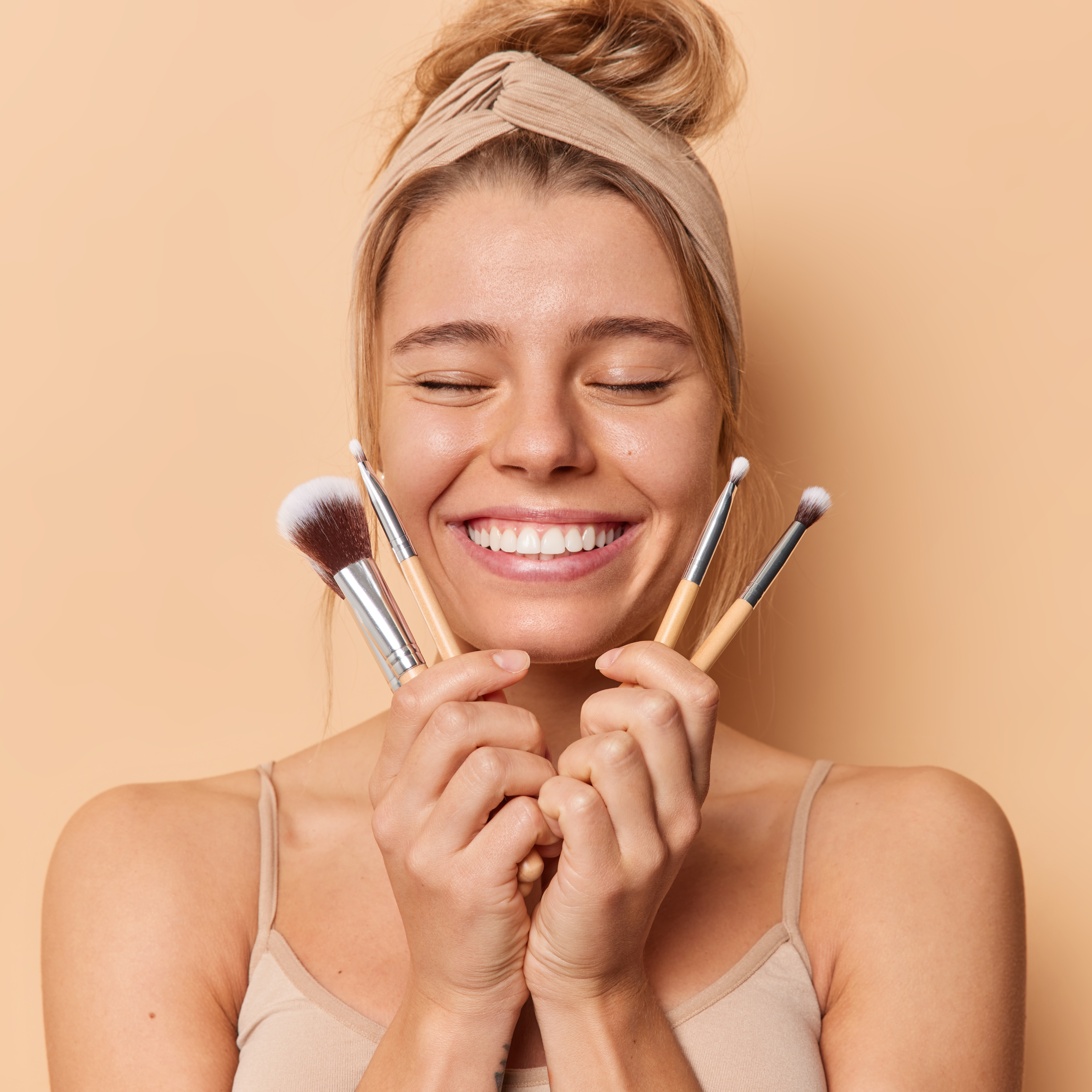Woman with Clean Foundation Brushes