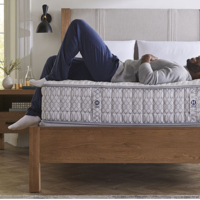 Man Laying on Mattress