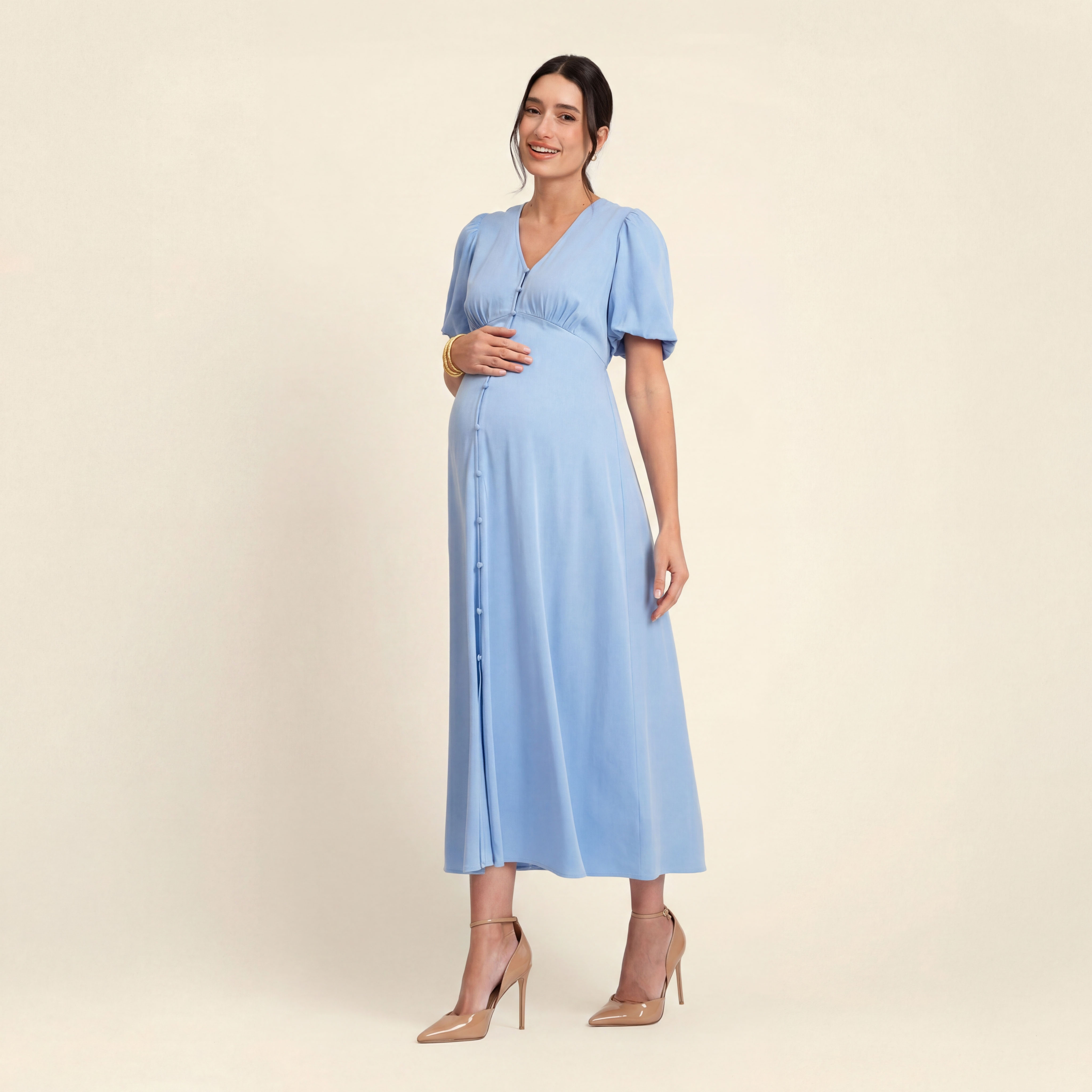 Woman in spring maternity dress