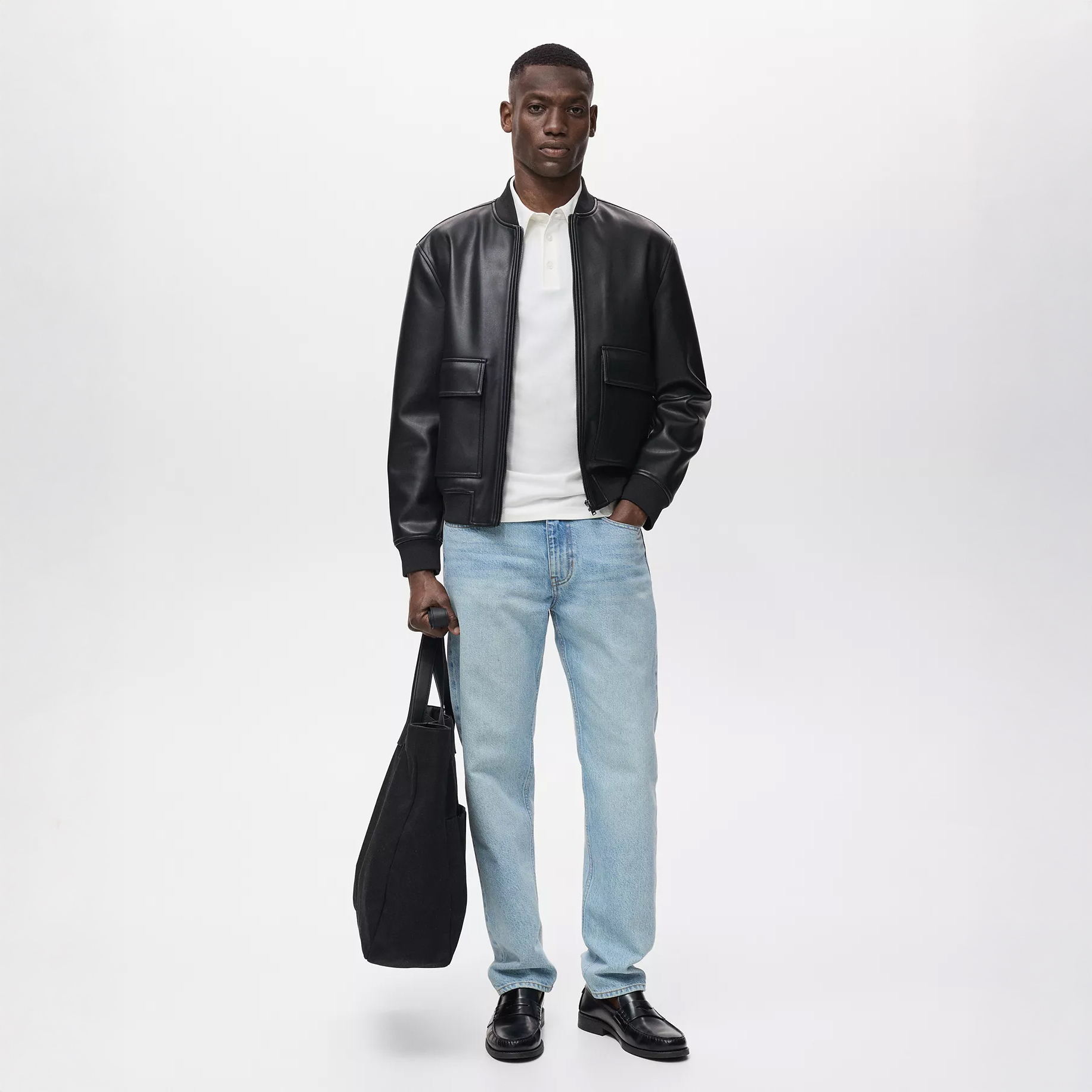 Man in black leather jacket and denim