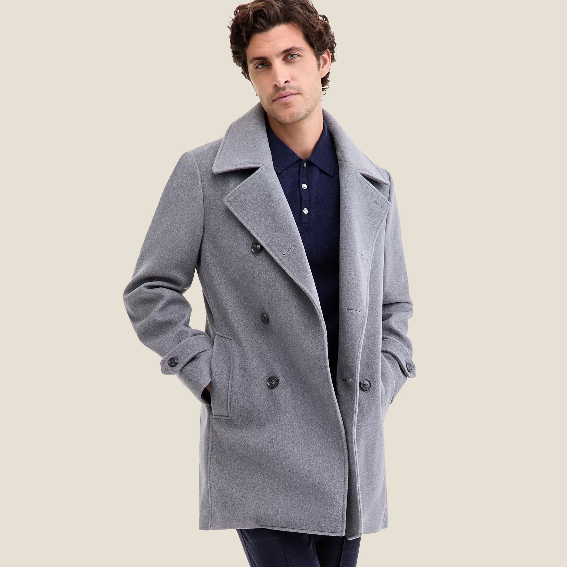 Man in light grey peacoat
