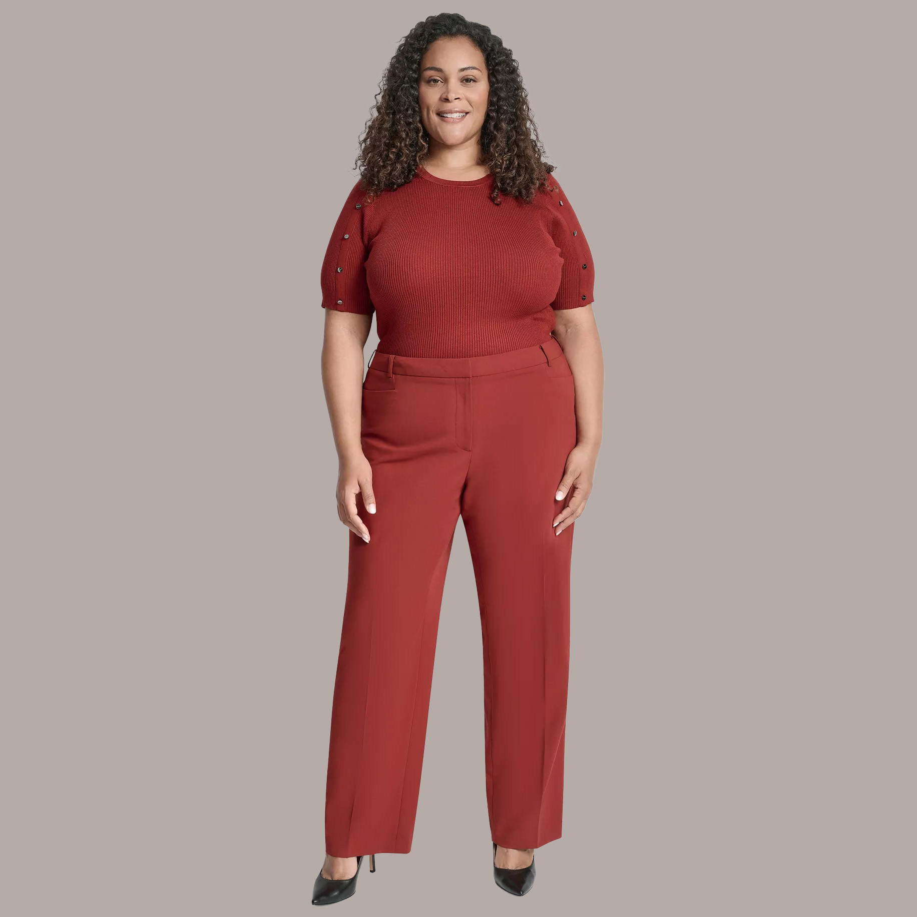 Woman in burnt orange monochromatic outfit