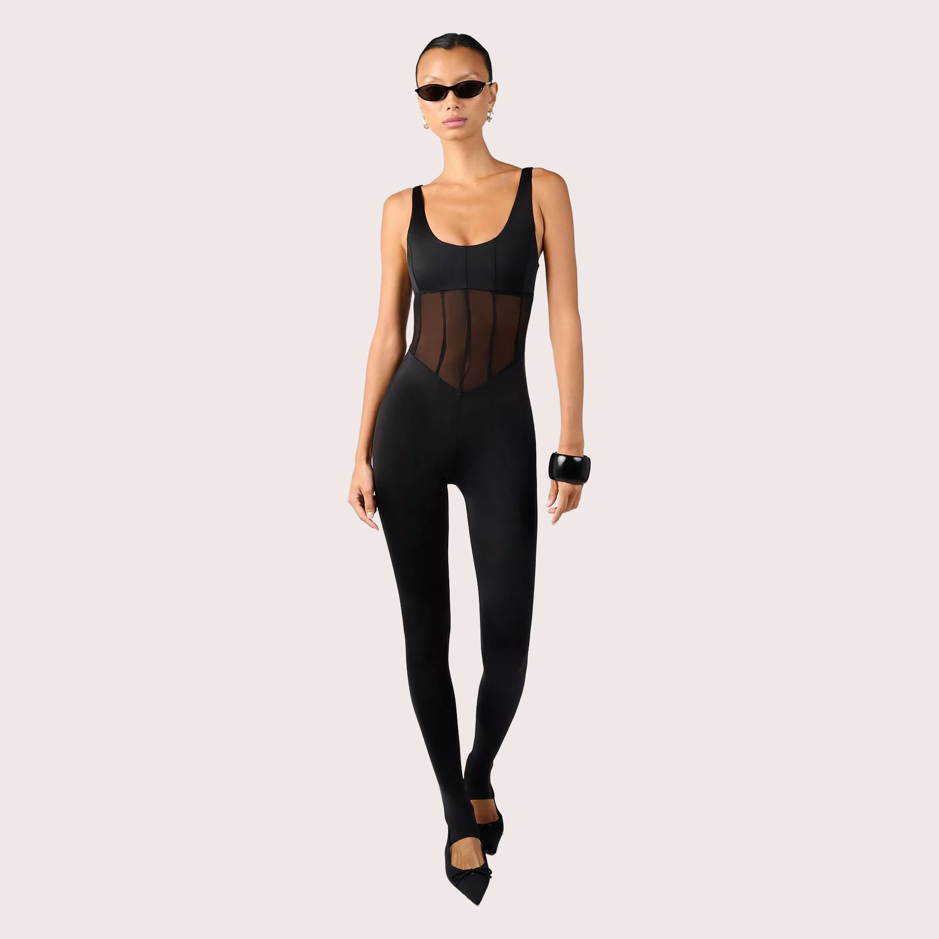 Woman in black sheer bodysuit