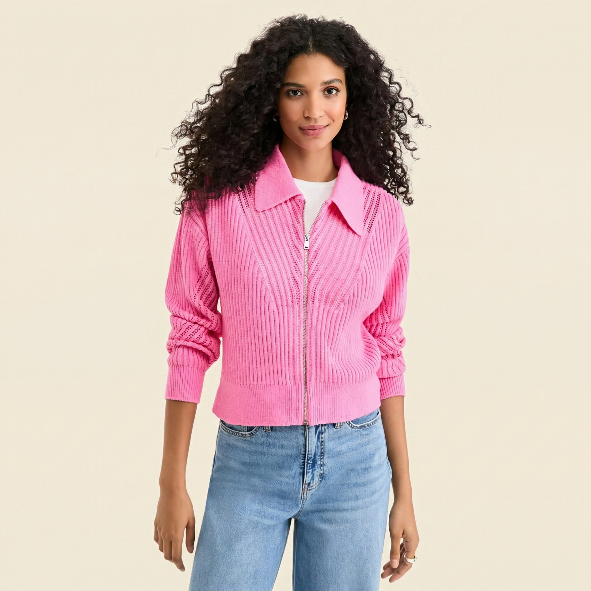 Woman in white t-shirt and spring pink zip-up cardigan