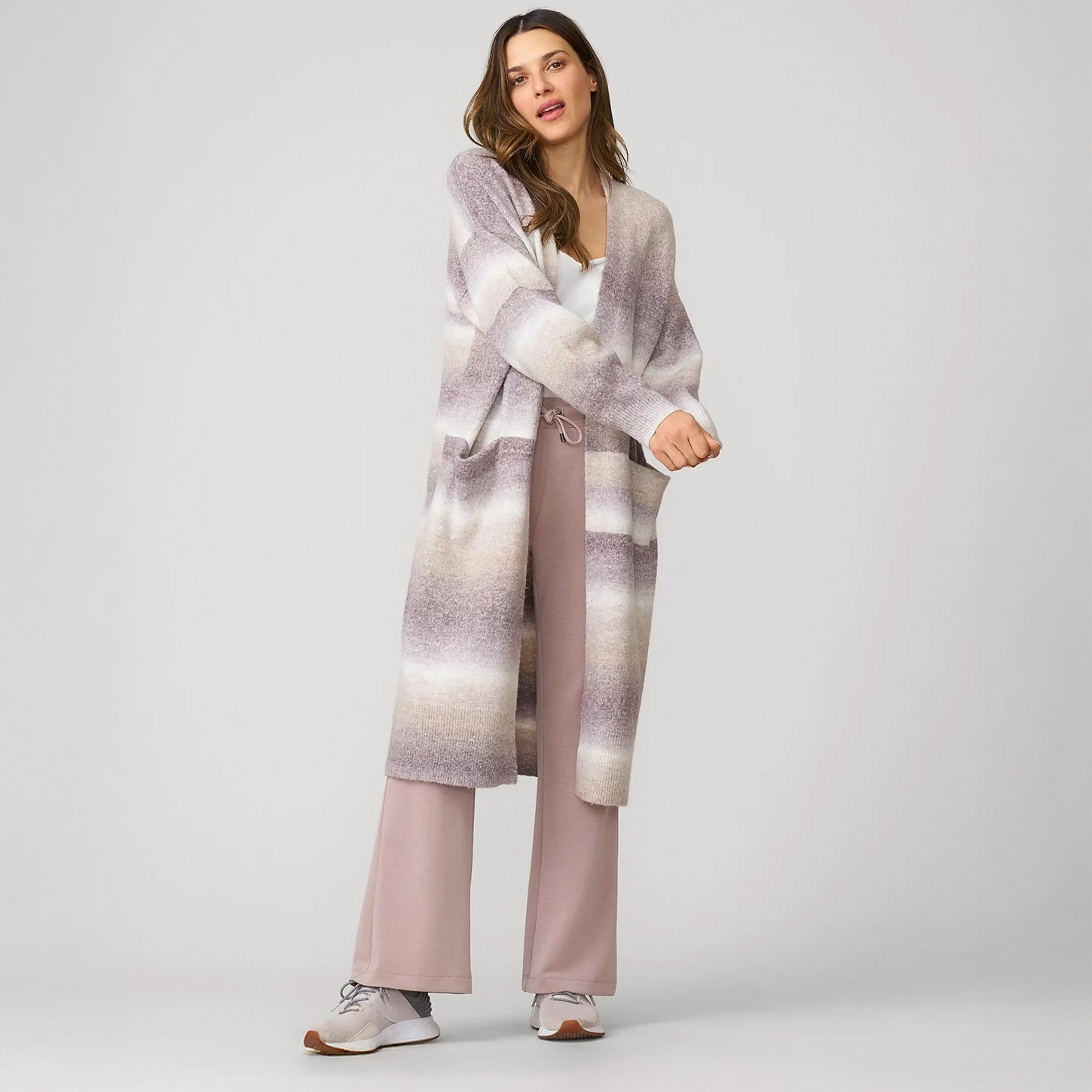 Woman in travel light cardigan and joggers