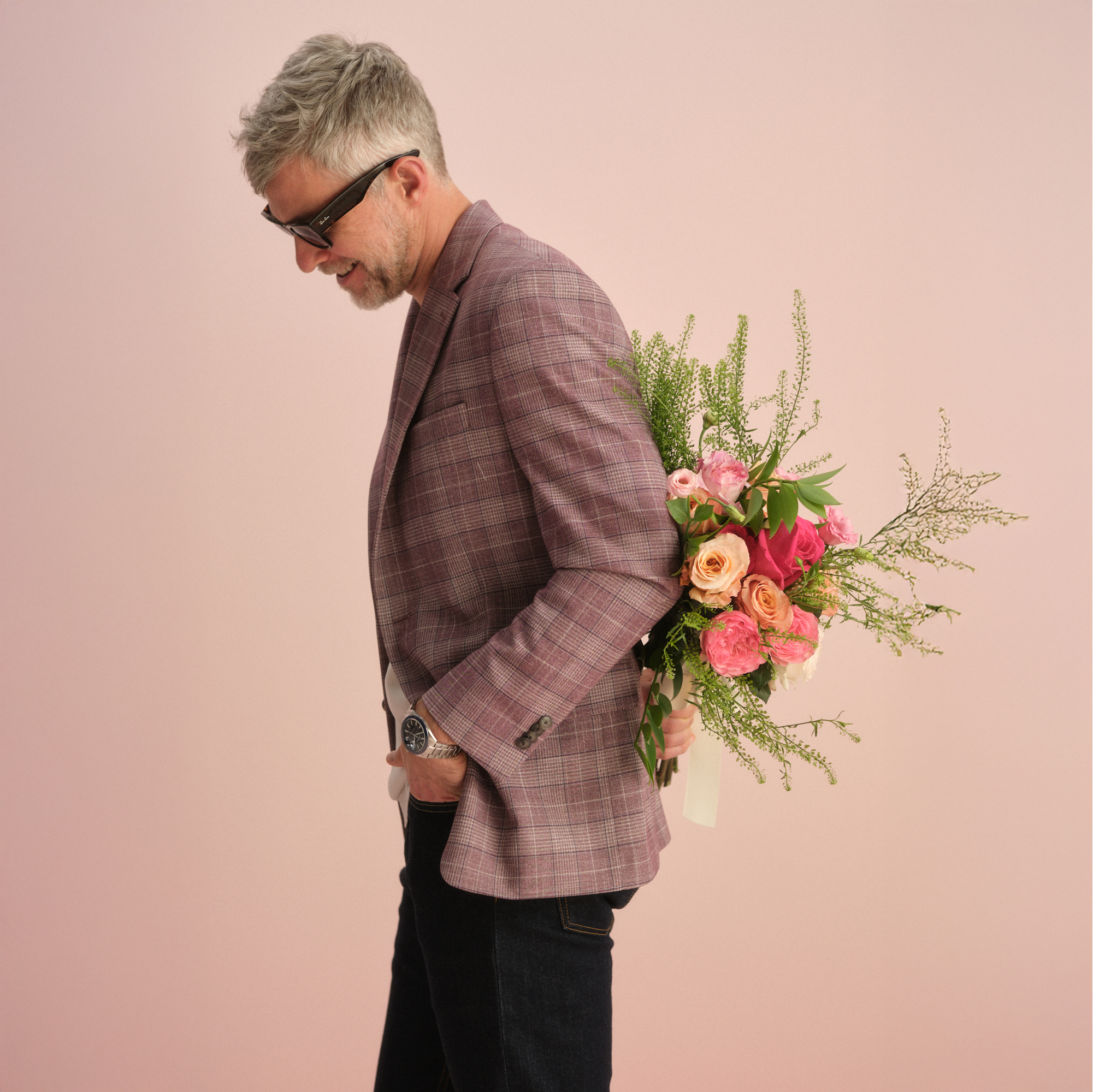 Man with blazer and flowers