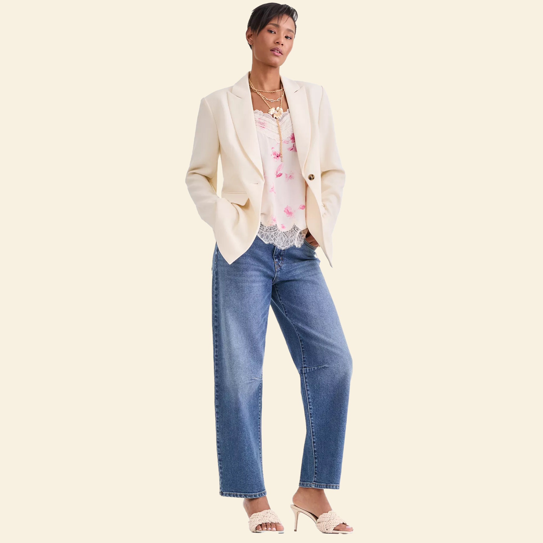Woman in cream blazer and jeans