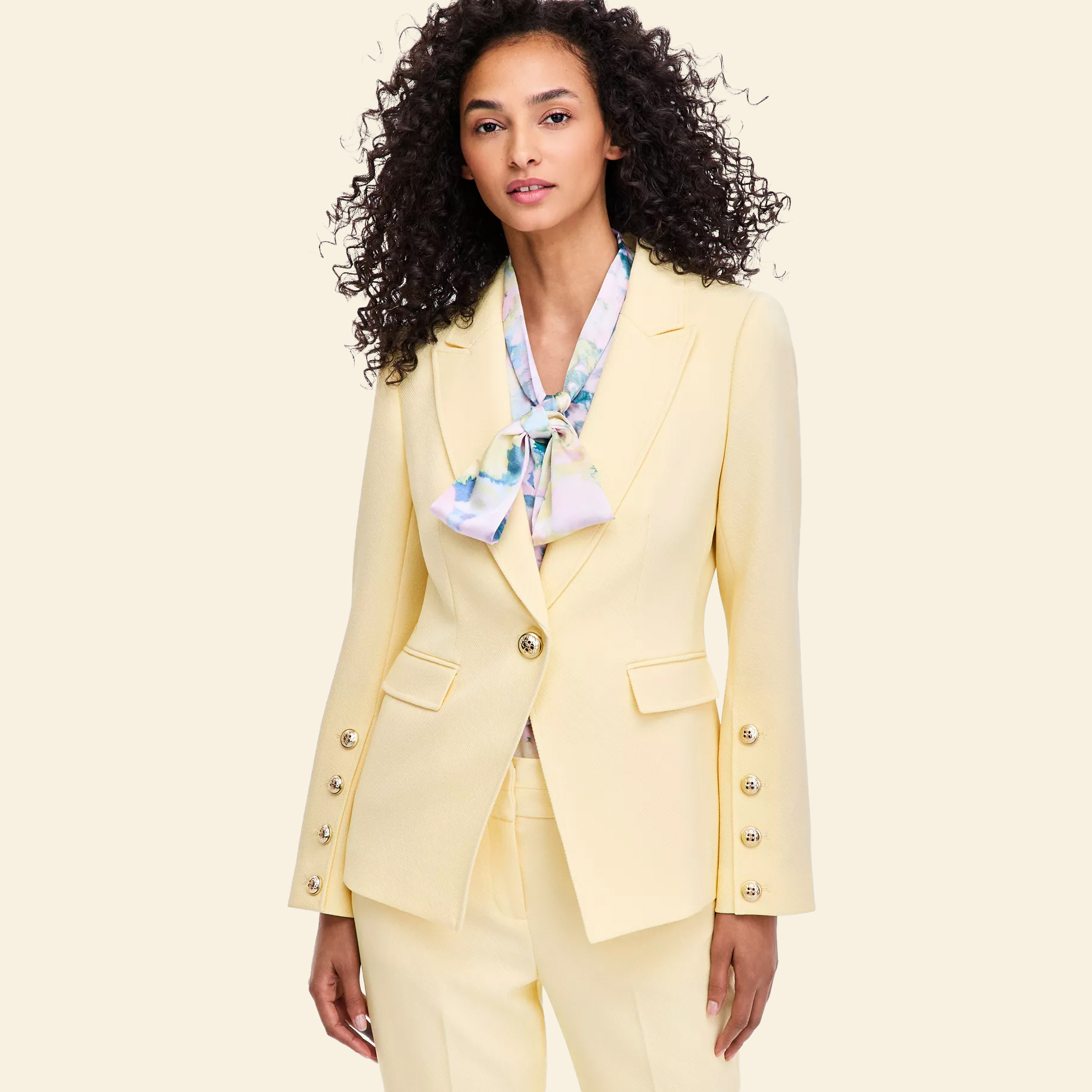 Woman in yellow single breasted blazer