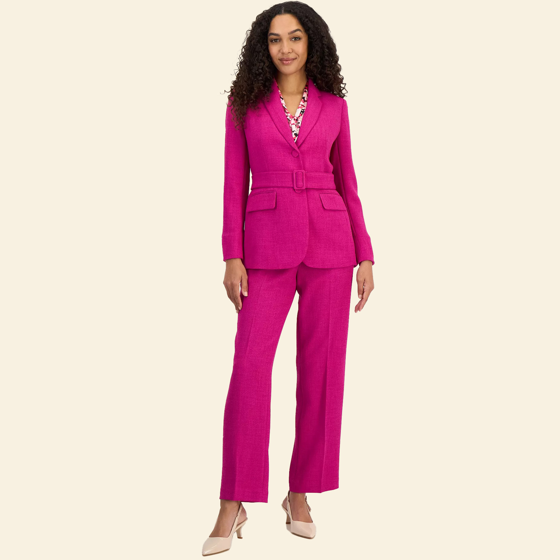 Woman in pink belted blazer