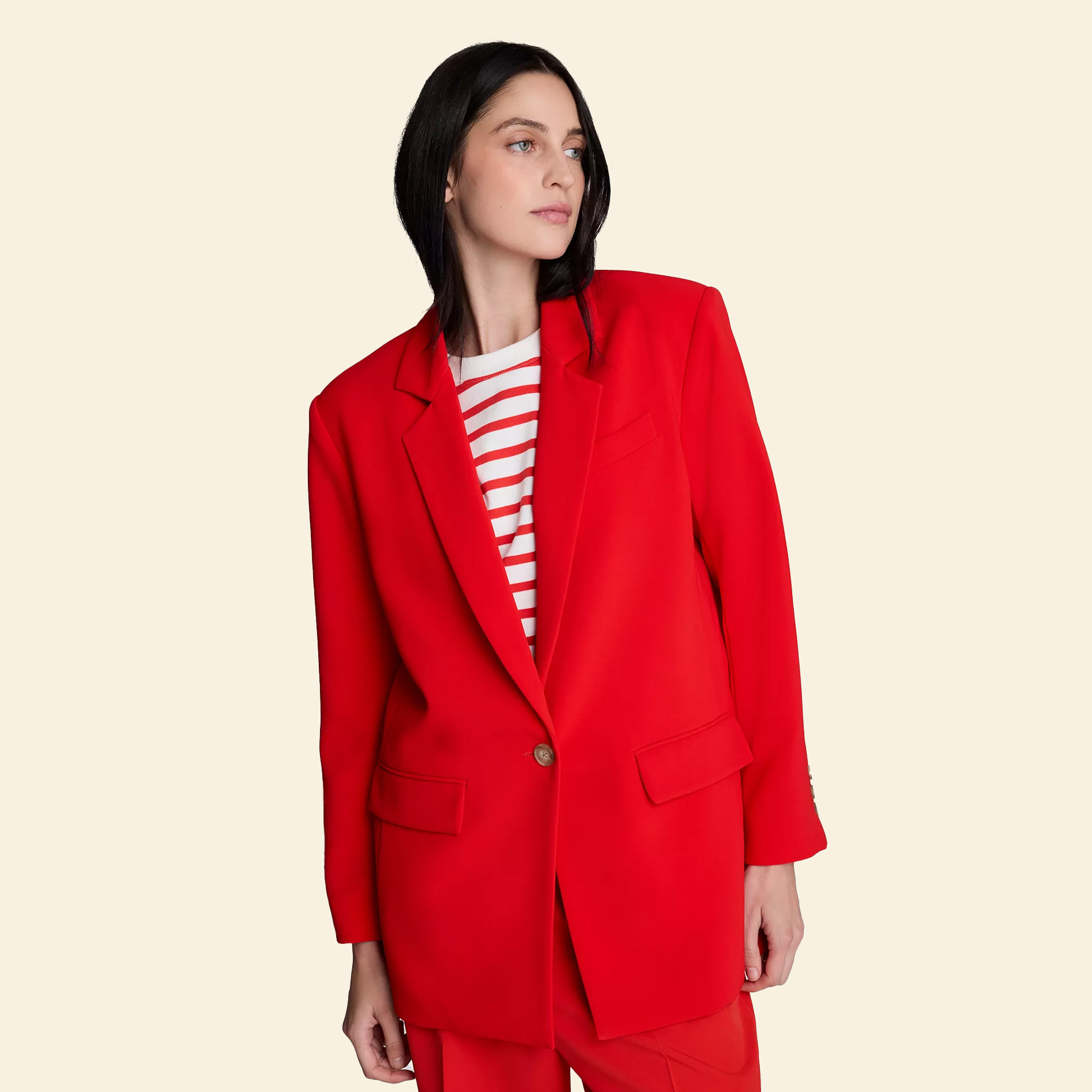 Woman in red oversized blazer