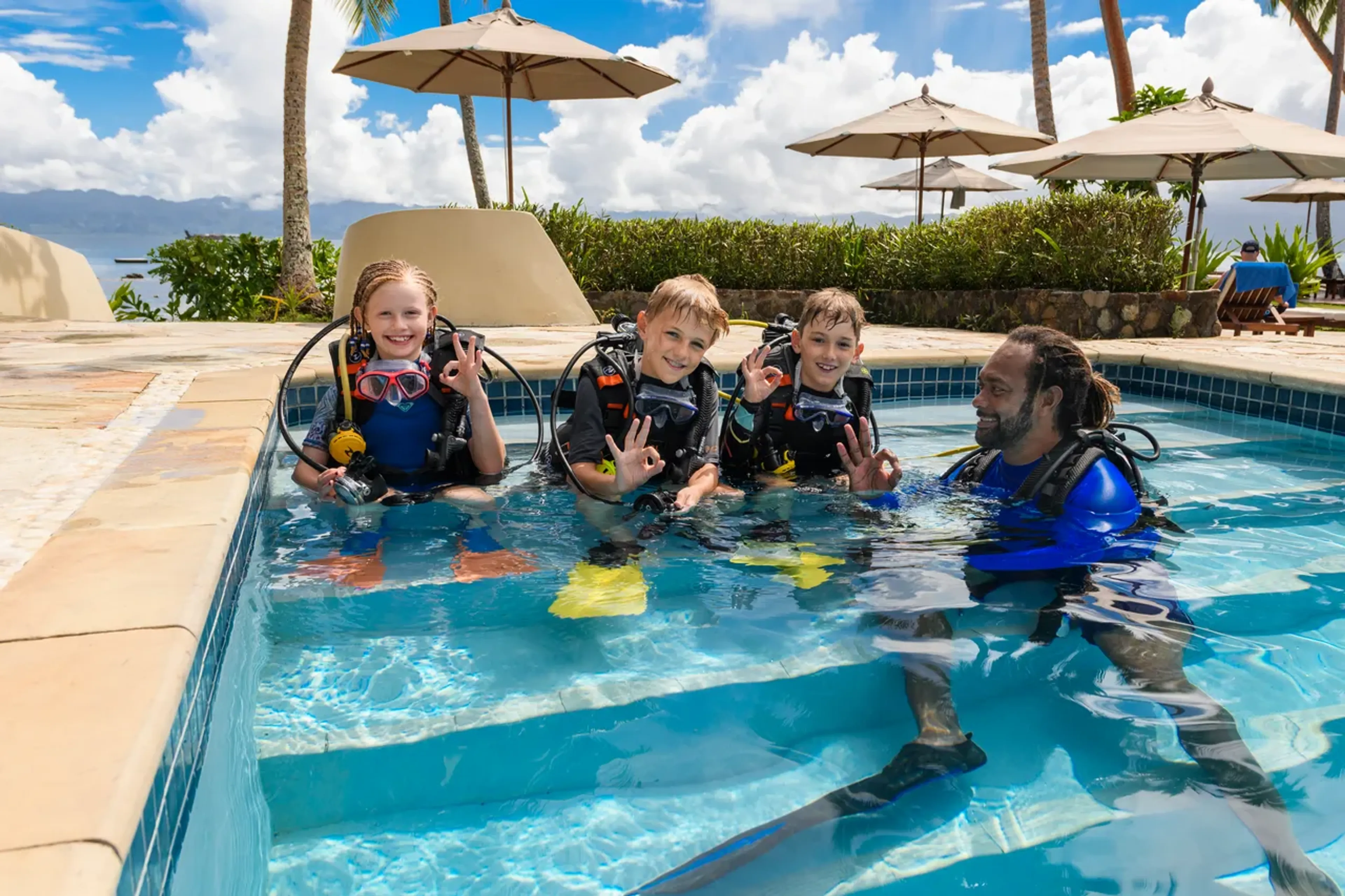 children learning to scuba dive