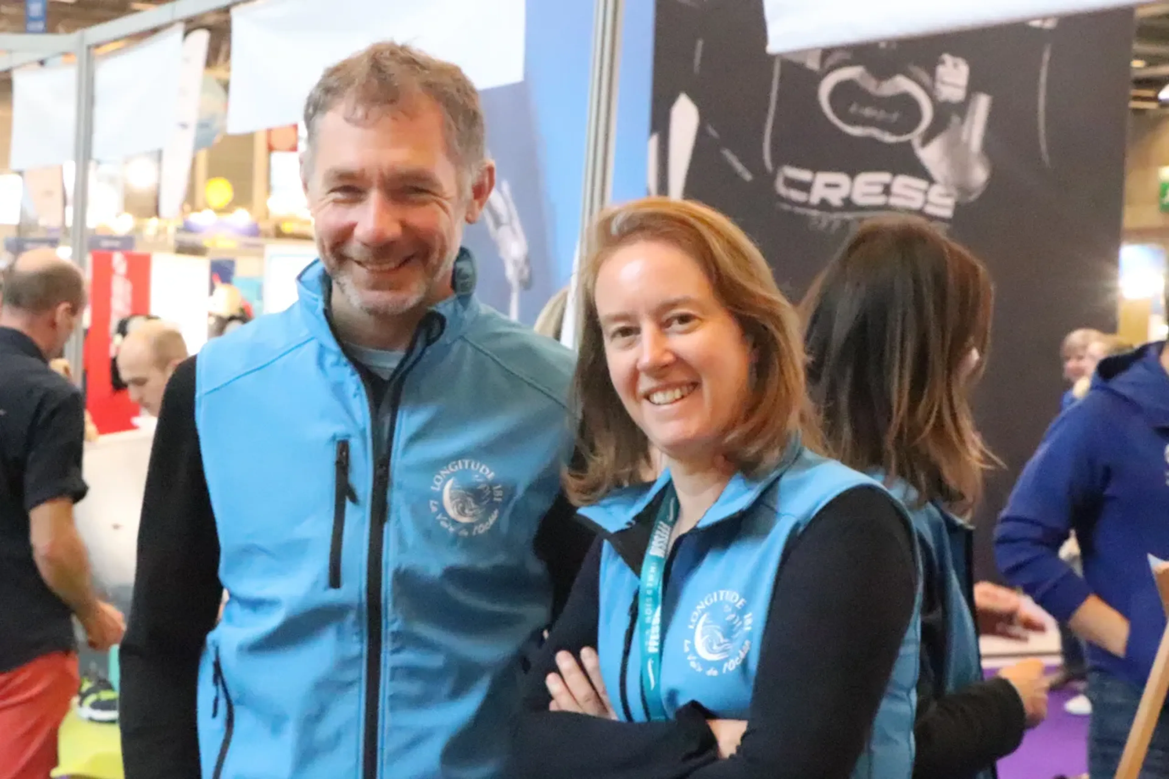 man and woman wearing longitude 181 vests