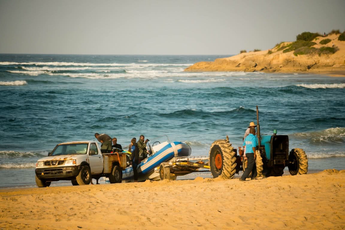 launching the boat from the beach