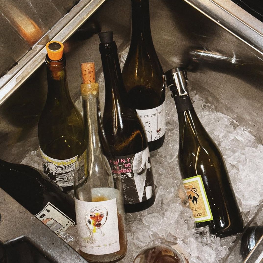 Photo of wine bottles at Goodtime Bar being chilled in ice