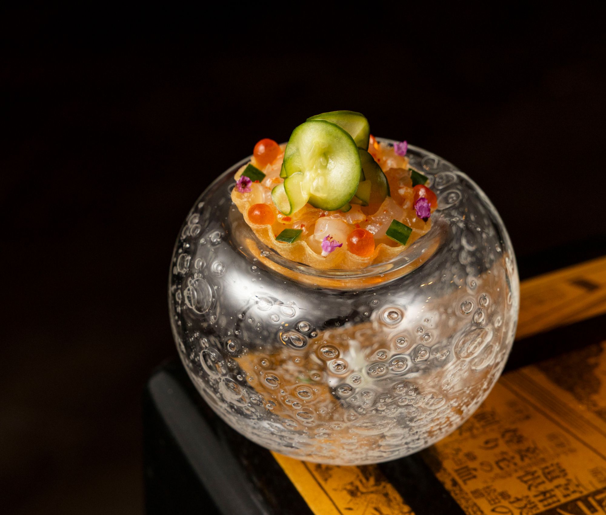 A dish being presented at MINŌ