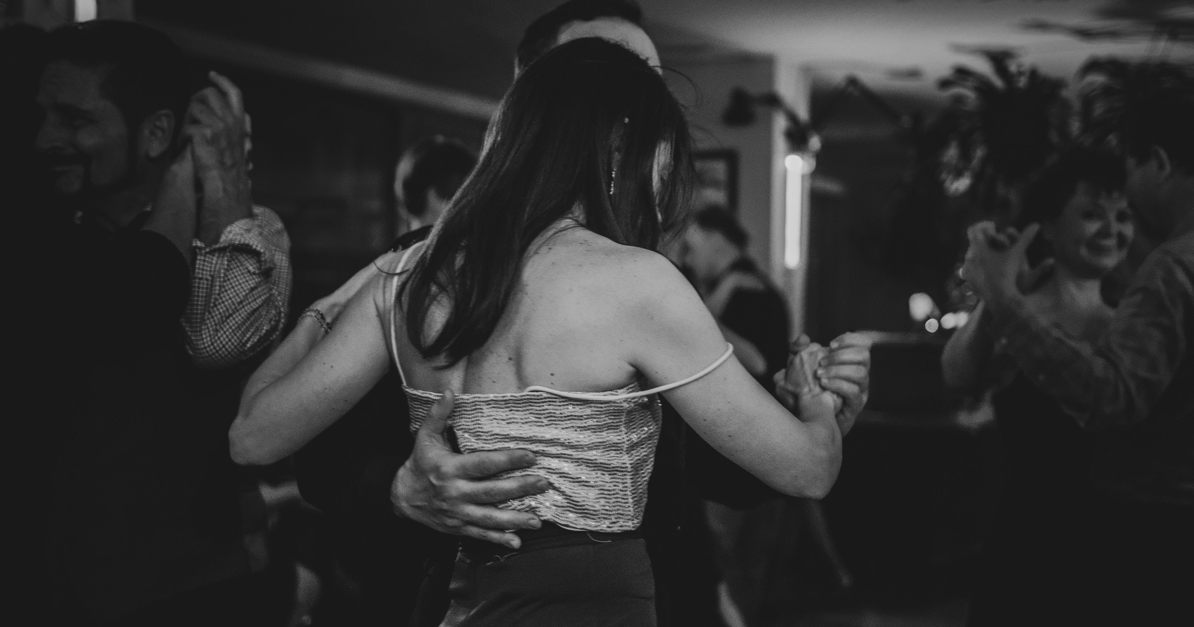 Couple dancing at a Play-Date Collective event
