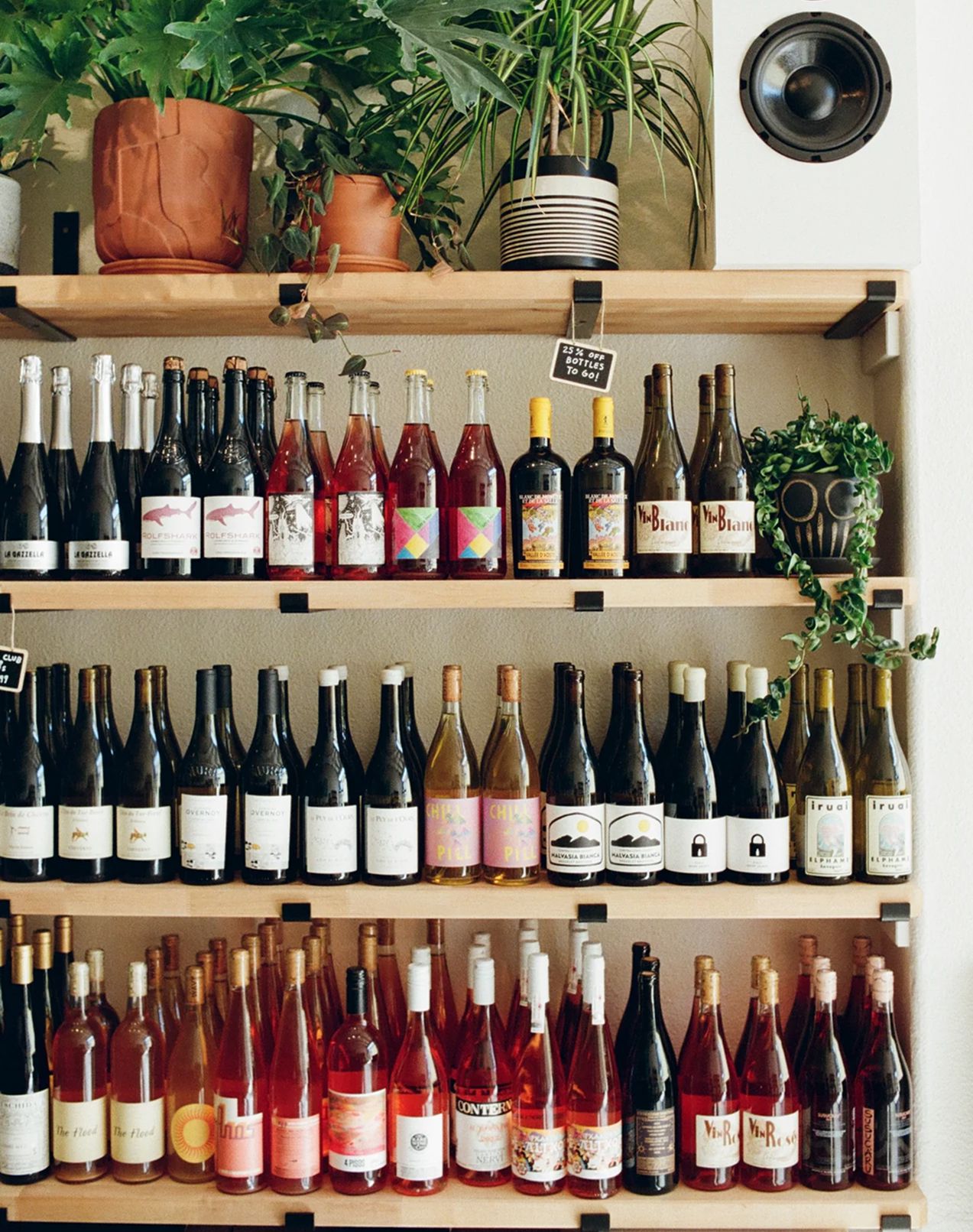 Photo of a shelf containing retail wine bottles at Rampant Bottle & Bar