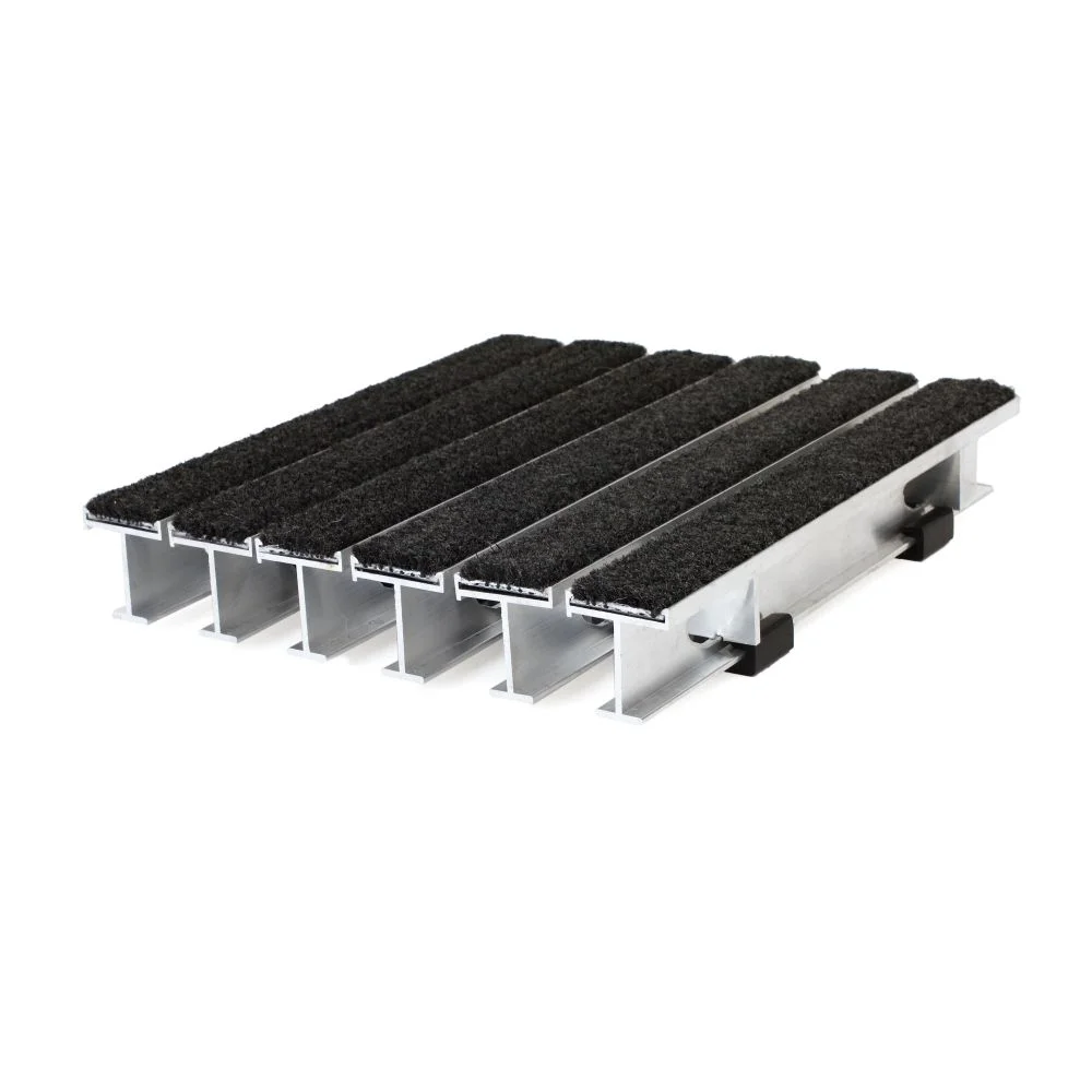 Activ-Grate 900 rigid grate section with black carpet treads on tall aluminum rails, shown from the end