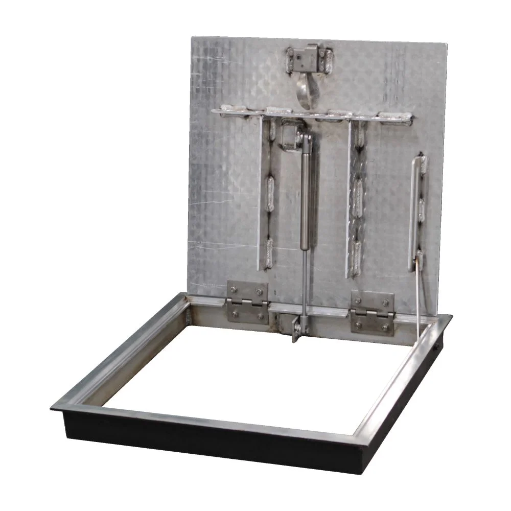 FLDE floor door for an existing opening, open, showing the stiffeners, gas spring and hinges under the diamond plate cover