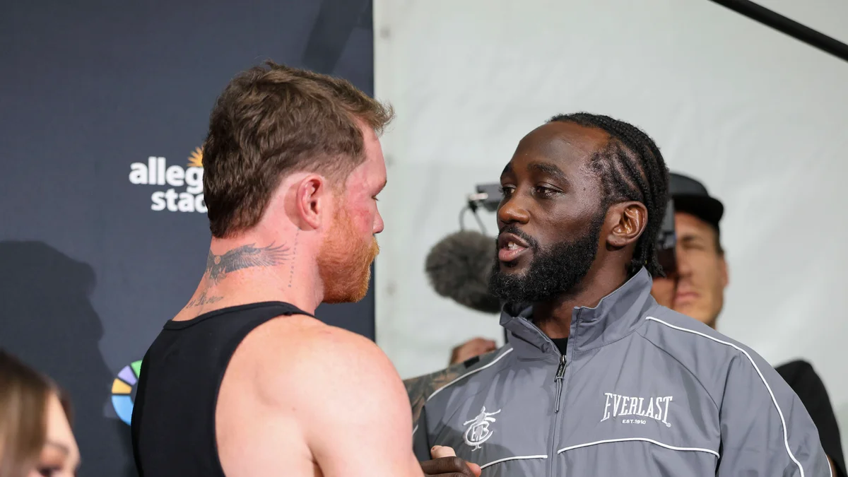 Terence Crawford (right) is congratulated by Canelo Alvarez at a press conference after their super middleweight title fight.