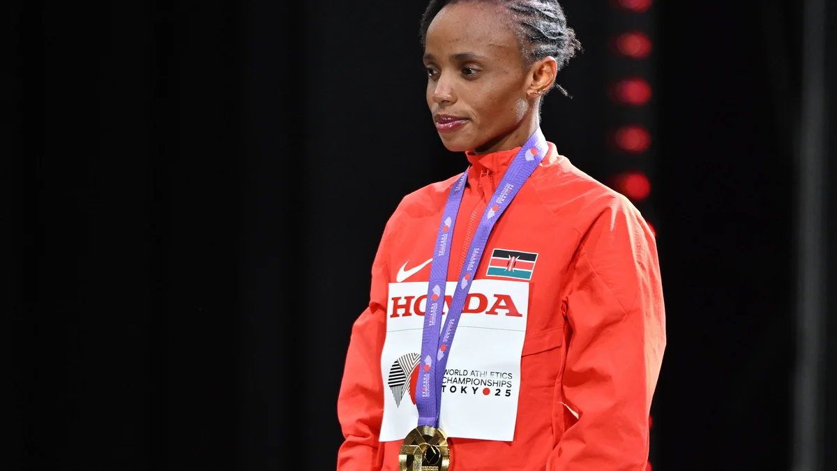 Olympic champion Beatrice Chebet smiles while running on the track at the World Athletics Championships.