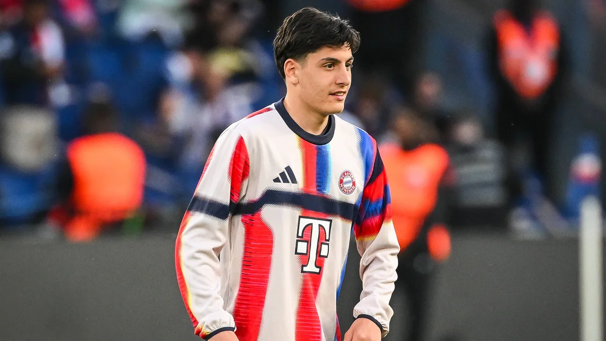 Deniz Ofli in a Bayern Munich jersey on the field during a Champions League match.