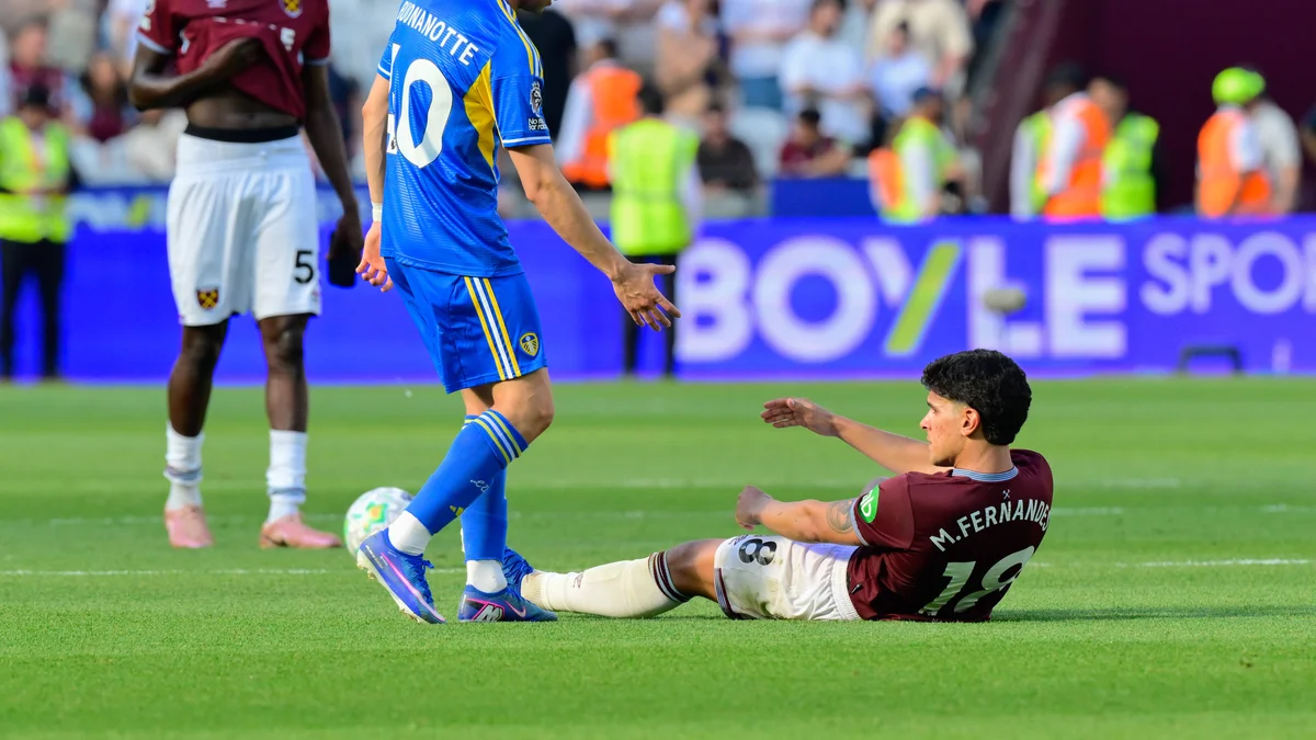Mateus Fernandes of West Ham United looks dejected on the pitch after his team's relegation.