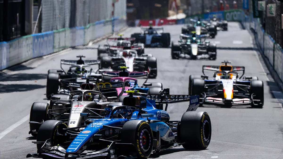 Carlos Sainz's Williams F1 car leads Nico Hülkenberg's Audi R26 during the Monaco Grand Prix.
