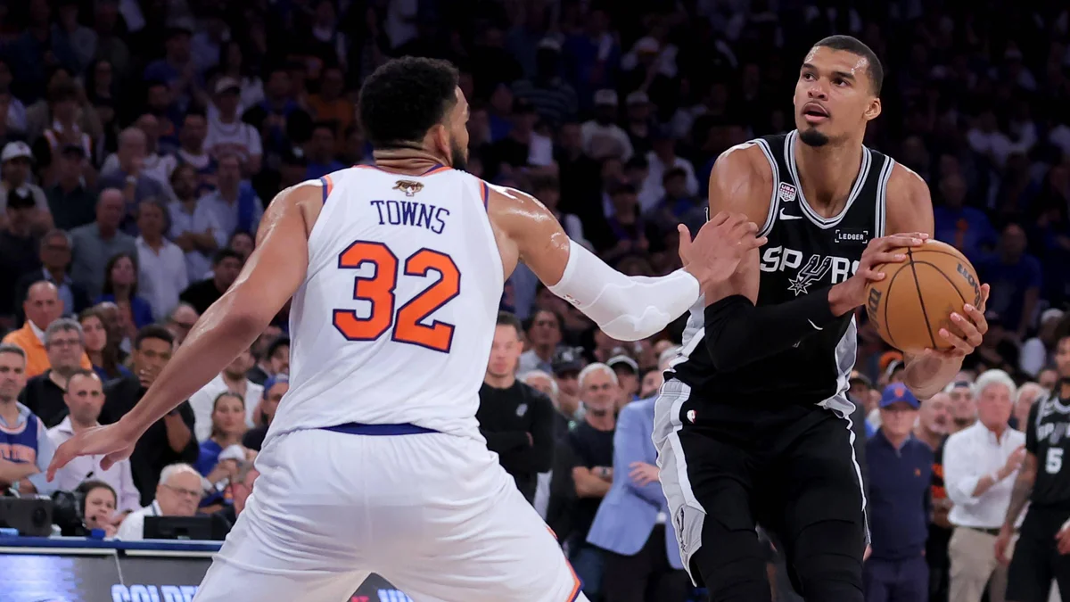 Victor Wembanyama shoots over Karl-Anthony Towns during the 2026 NBA Finals.