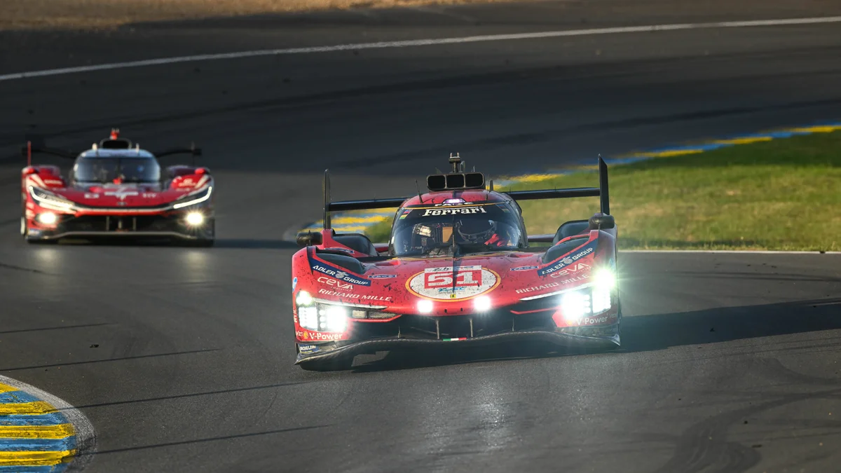 A red Ferrari 499P Hypercar, number 51, races on the track during the 24 Hours of Le Mans.