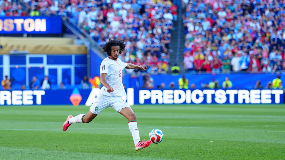 Ayoub Bouaddi in a Morocco national team kit, dribbling a football during a 2026 FIFA World Cup match.