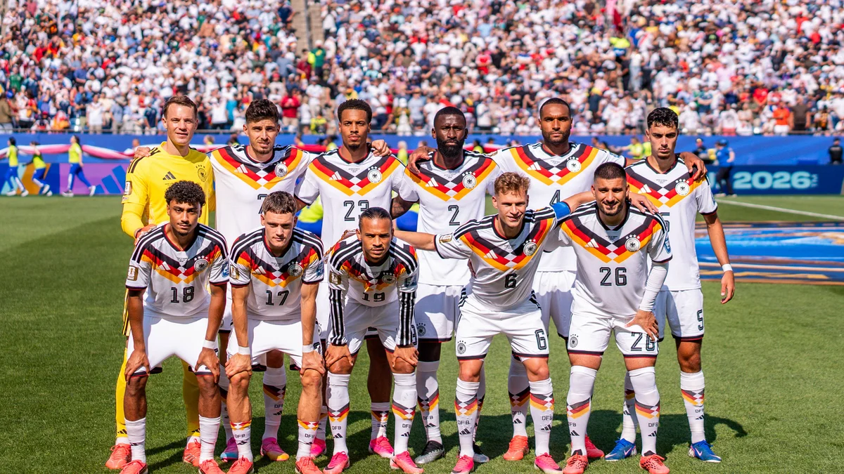 Nathaniel Brown stands with the German national football team in a group photo at the 2026 FIFA World Cup.