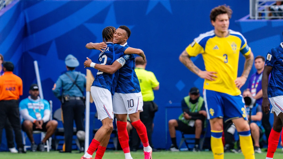 Bradley Barcola, in a blue France jersey, celebrates scoring a goal during the 2026 FIFA World Cup.