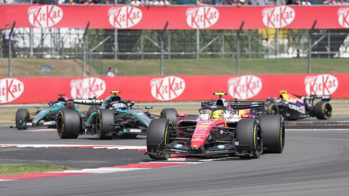 Lewis Hamilton in his red Ferrari race car on the track during the British Grand Prix.