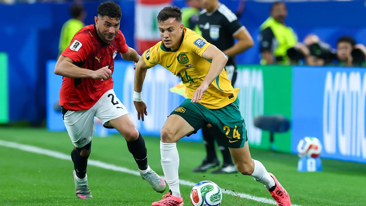 Australia midfielder Paul Okon-Engstler (24) runs along the sideline during a FIFA World Cup match against Egypt.